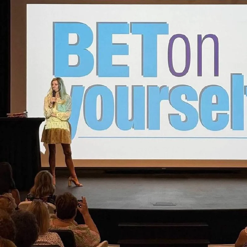 Molly Grantham presenting Bet On Yourself to a theater audience