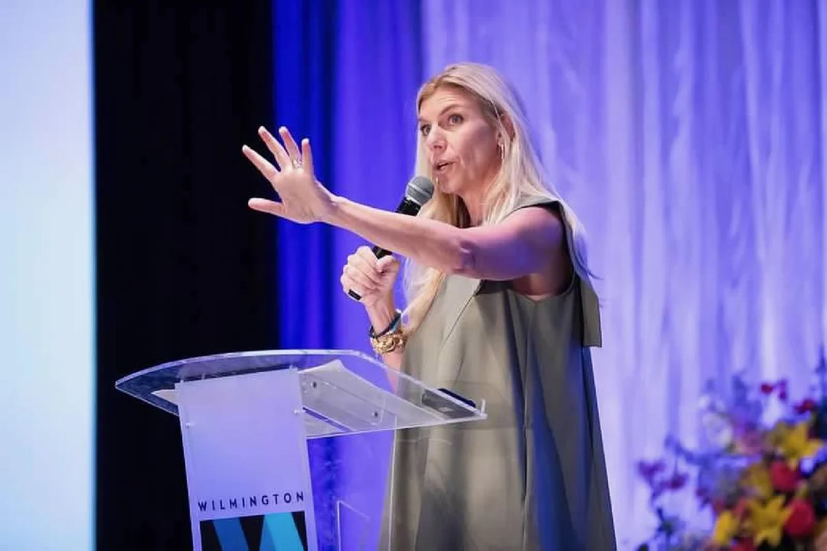 Molly Grantham gesturing to the audience mid-keynote